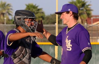 Anthony Zaragoza and Jack Foote congratulate each other after Thursday's season-ending win over Hanford, an 8-5 victory.